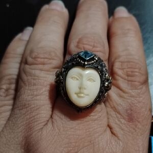 Bali Designs Sterling Silver, Gold Accented Bone Carved Face Ring w/ Blue Topaz